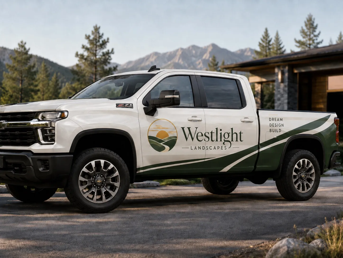 The Westlight crew truck, wrapped in the sunrise logo, parked outside a mountain modern home in the foothills